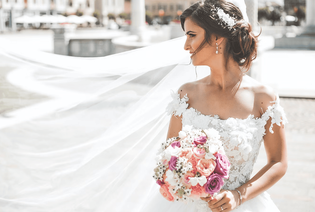 Premium Photo | Beautiful bride holding expensive silver necklace with  pearls on neck woman in white gown with lace floral ornaments bridal  morning preparations stylish jewelry boudoir photo