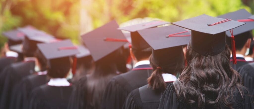 shot of graduation hats during commencement success graduates of